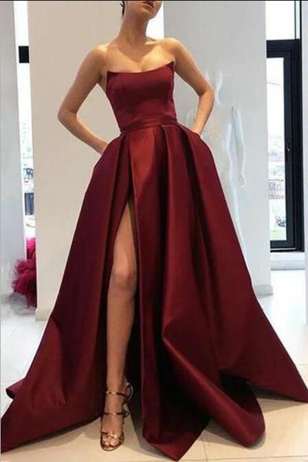 curved-strapless-burgundy-prom-gowns-slit-side