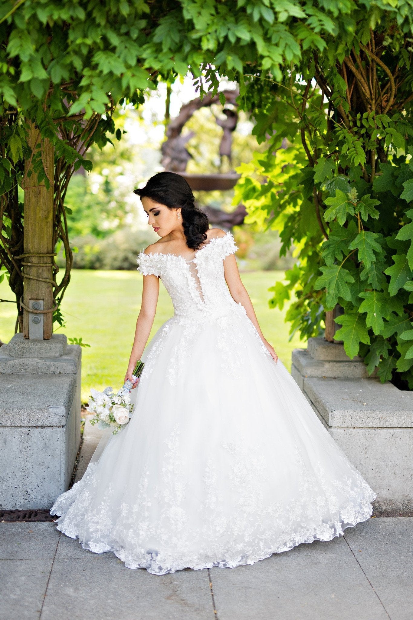 plunging-neckline-white-wedding-gown-with-flower-off-the-shoulder-2